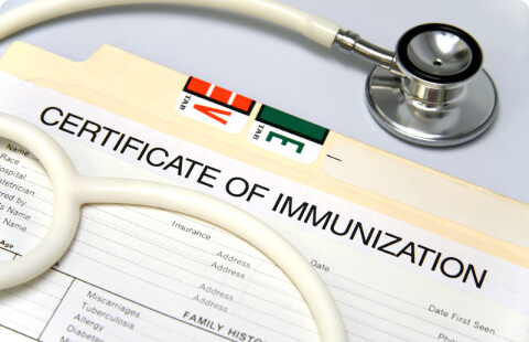 certificate of immunisation and stethoscope